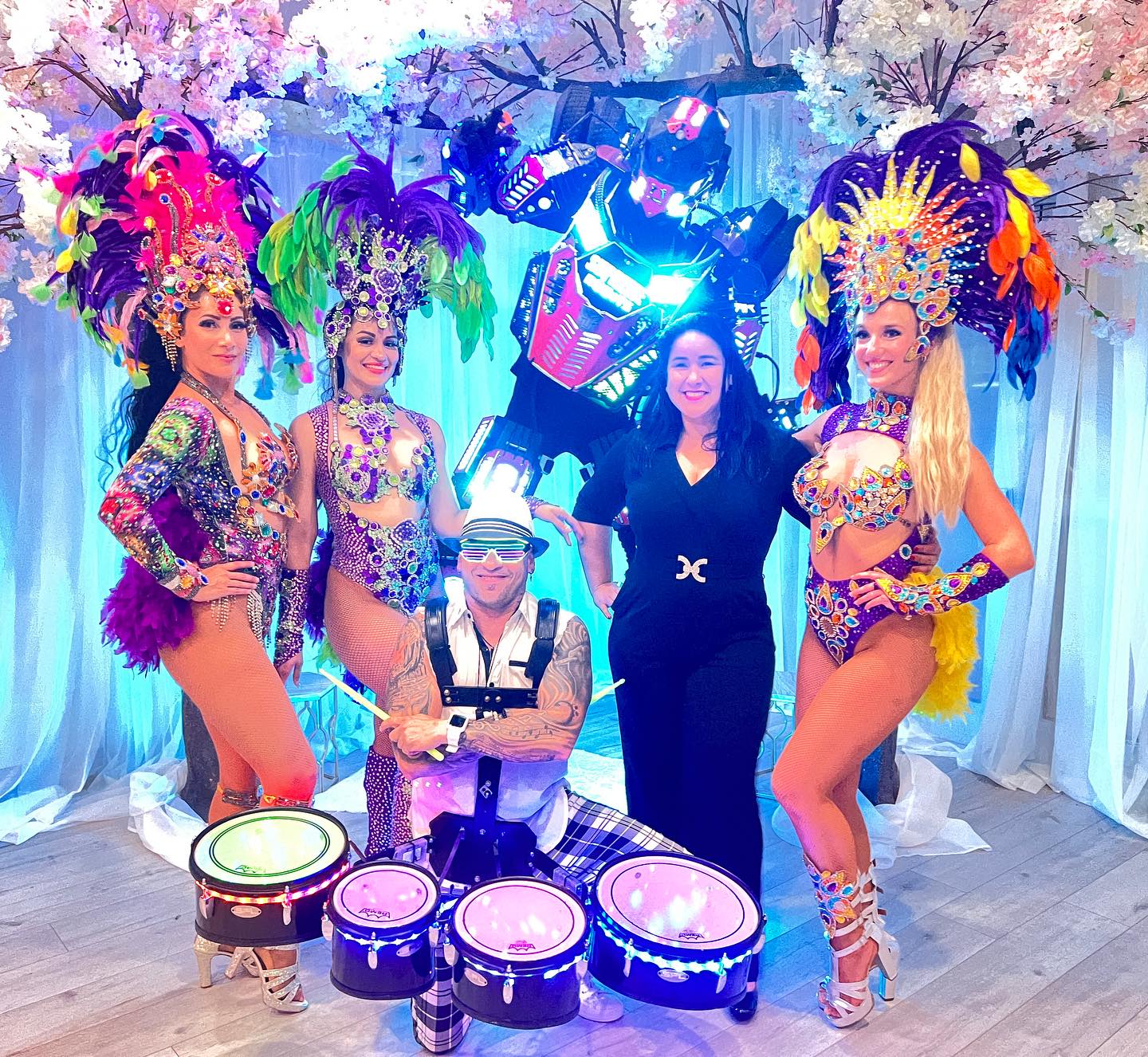 Hora Loca dancers in custom feathered costumes in Naples, FL