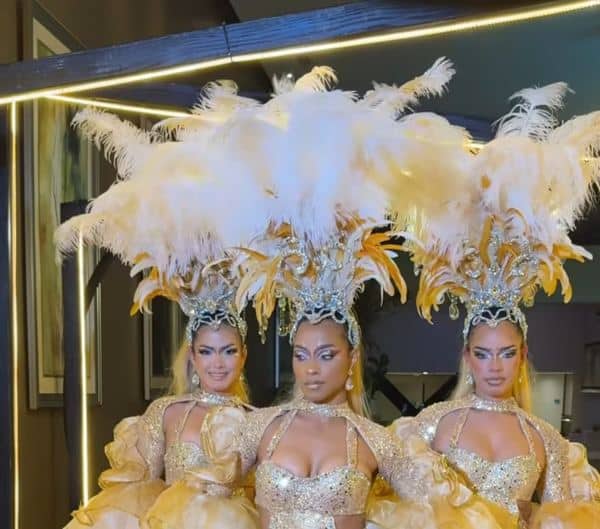 Vegas showgirls and greeters in feather headdresses in Naples, FL